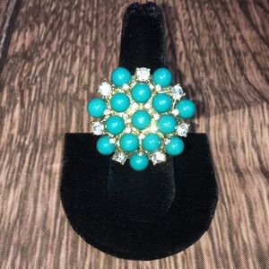 Turquoise and rhinestone ring.